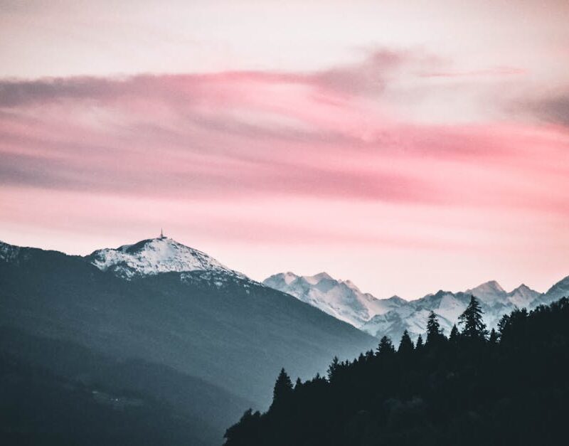 Mountain Landscapes - Captivating sunset over snow-capped peaks in Jen #1054289