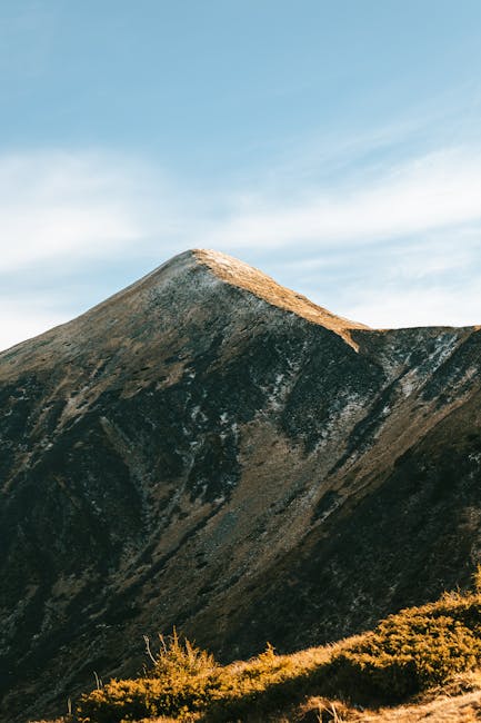 Mountain Landscapes - A breathtaking view of a majestic mountain peak #11960498