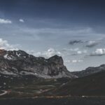 Mountain Landscapes - Dramatic mountain landscape under a cloudy sky i #12265989