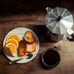 Food Aesthetics - Warm breakfast scene with coffee, toast, and ora #14792353