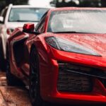 Luxury Cars - Stunning red supercar glistening with raindrops #18772558