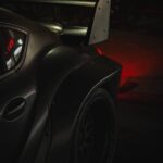 Luxury Cars - Dark, edgy shot of a sports car's rear and spoil #19209325