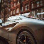 Luxury Cars - A stylish gray supercar parked in a vibrant city #20297007