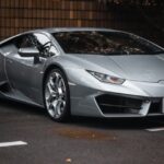 Luxury Cars - Sleek silver Lamborghini Huracan parked in city #23124134