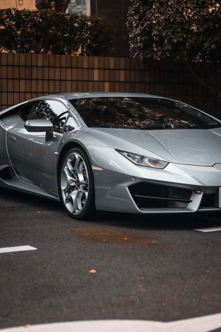 Luxury Cars - Sleek silver Lamborghini Huracan parked in city #23124134