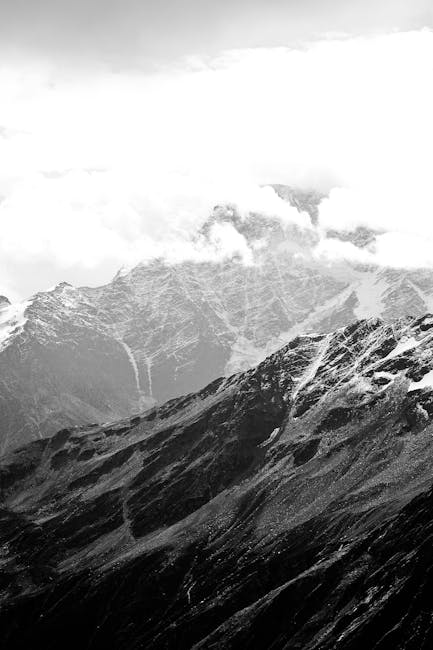 Mountain Landscapes - Explore the serene beauty of a snowcapped mounta #24259728