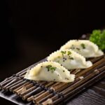 Food Aesthetics - Close-up of tasty Asian dumplings garnished with #27039846