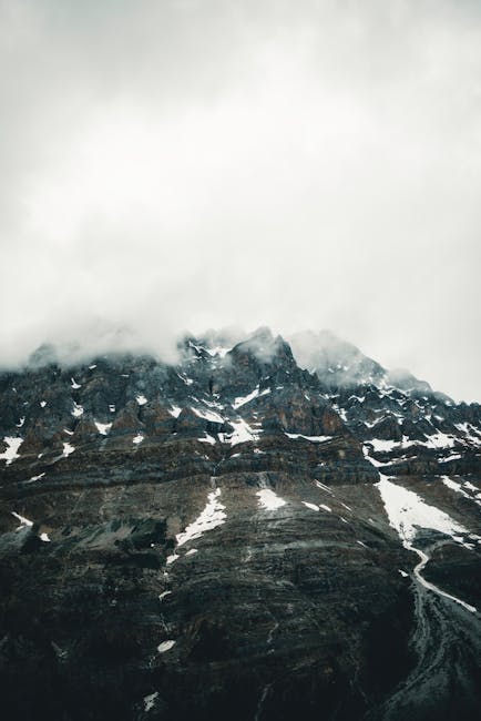 Mountain Landscapes - Dramatic, mist-covered mountain peaks in Banff N #27501744