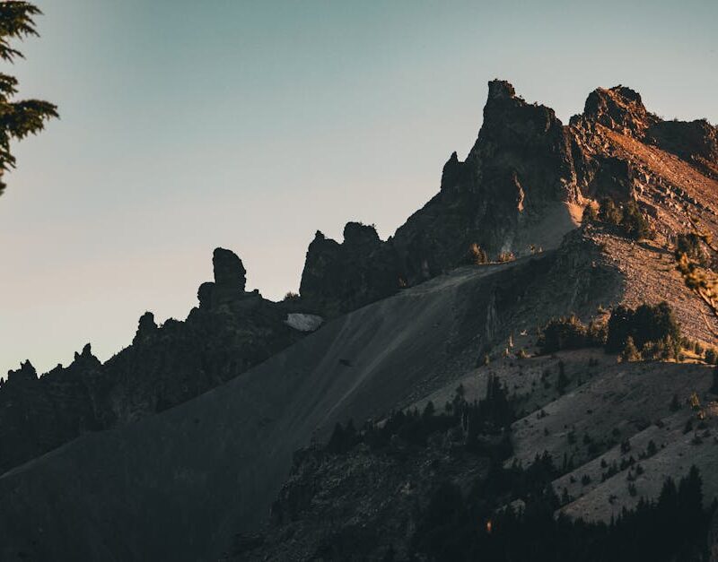 Mountain Landscapes - Majestic sunset view of rugged mountain peaks at #28820421