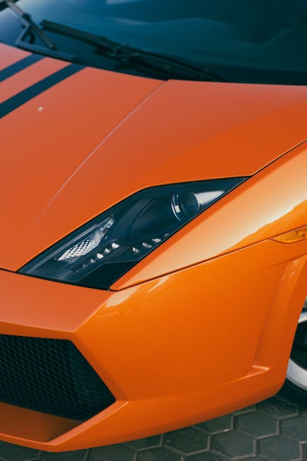 Luxury Cars - Vibrant orange sports car front view showcasing #29884351