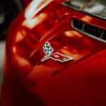 Luxury Cars - Bold red sports car with a sleek iconic emblem, #31727904