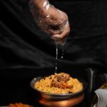 Food Aesthetics - Close-up of lemon juice being added to a bowl of #32825910