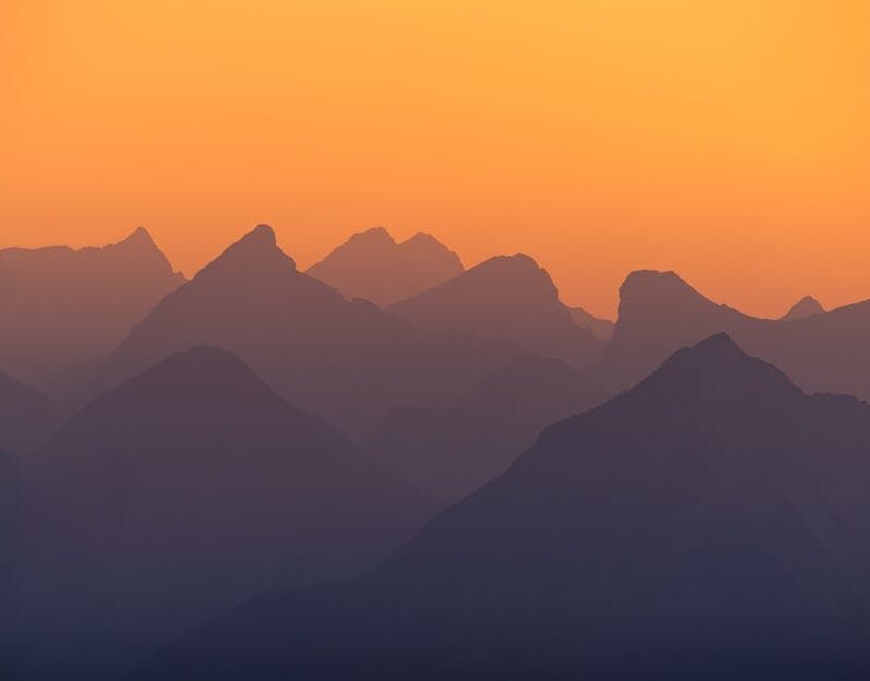 Mountain Landscapes - Beautiful silhouette of the Austrian Alps at sun #33670090