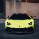Luxury Cars - A sleek Lamborghini Aventador in lime green park #33840240