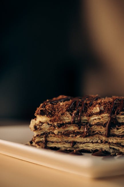 Food Aesthetics - Rich chocolate layered dessert on a plate, perfe #34159029