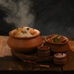 Food Aesthetics - Clay pots with steaming rice and chicken curry s #34159112