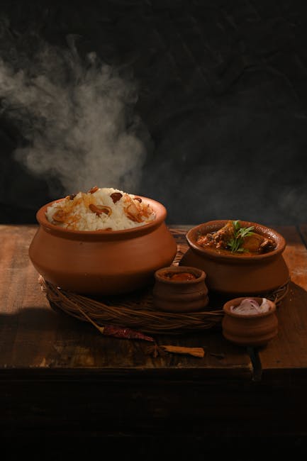 Food Aesthetics - Clay pots with steaming rice and chicken curry s #34159112