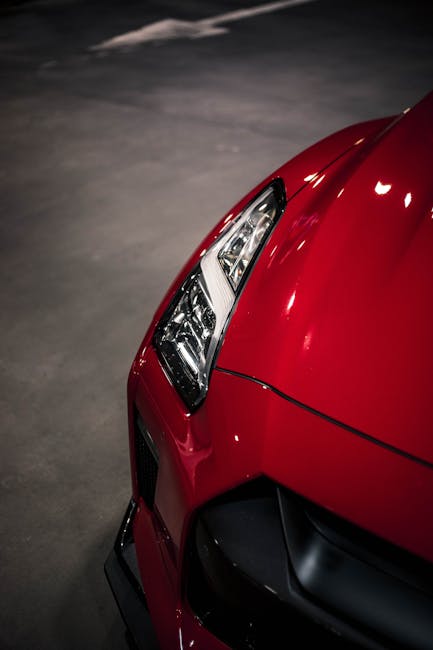 Luxury Cars - Close-up shot of a red Nissan GTR headlight in a #34277065