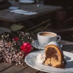 Food Aesthetics - A slice of marble cake with coffee and flowers o #35121843
