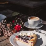 Food Aesthetics - Delicious berry tart slice on a plate with coffe #35121845