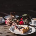 Food Aesthetics - Delicious berry tart with cream served alongside #35121850