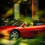 Luxury Cars - Red Ferrari parked outside an urban cafe, surrou #35189511