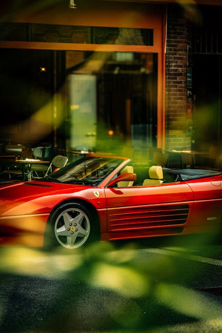 Luxury Cars - Red Ferrari parked outside an urban cafe, surrou #35189511