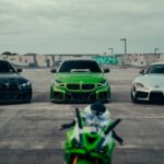 Luxury Cars - Green sports motorcycle and cars on graffiti-ado #36542641