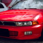Luxury Cars - Close-up of a bright red vintage sports car park #36903246