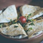Food Aesthetics - Close-up of a tasty quesadilla garnished with fr #58722
