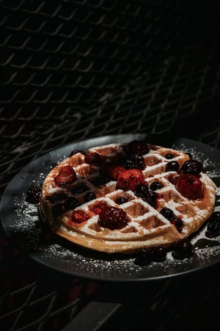 Food Aesthetics - Dark moody shot of a waffle topped with fresh be #8178424